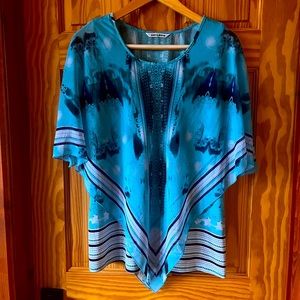 Sleeveless Top with Attached Sheer V Shape Covering